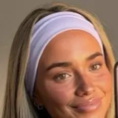 Profile photo of a young woman in a lavender headband