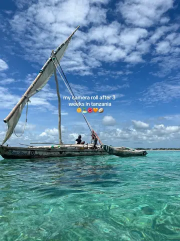 First slide: my camera roll after 3 weeks in tanzania 🌞🌊🦒🧡🥥