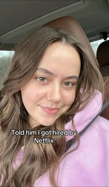 Selfie in a car, text: told him I got hired by Netflix