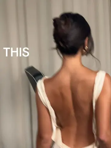 A woman's bare back and one word: this