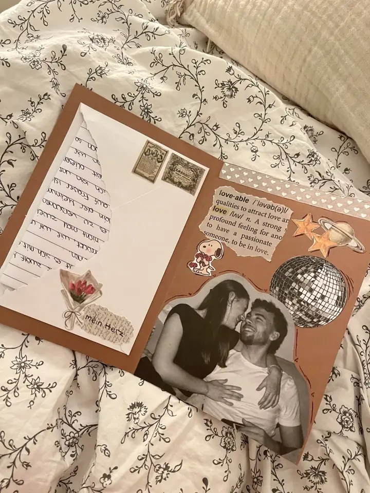 Slide 5: a scrapbook collage with a couple photo, stamps and a disco ball sticker on a bed