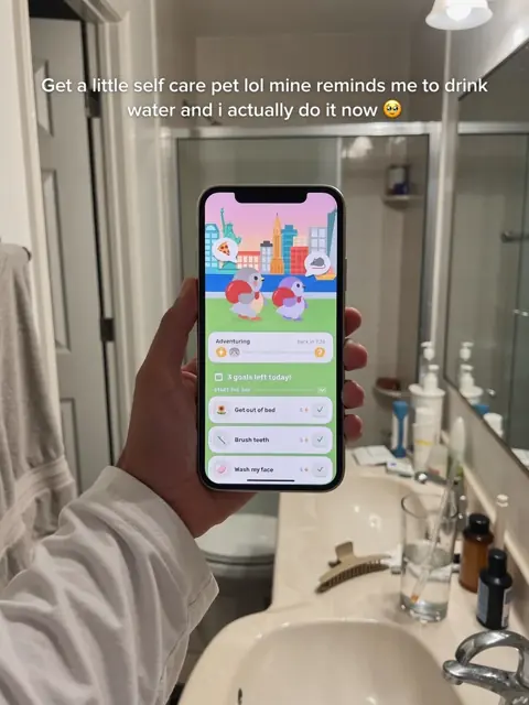 Slide 4: her phone at the bathroom sink showing a self-care pet app