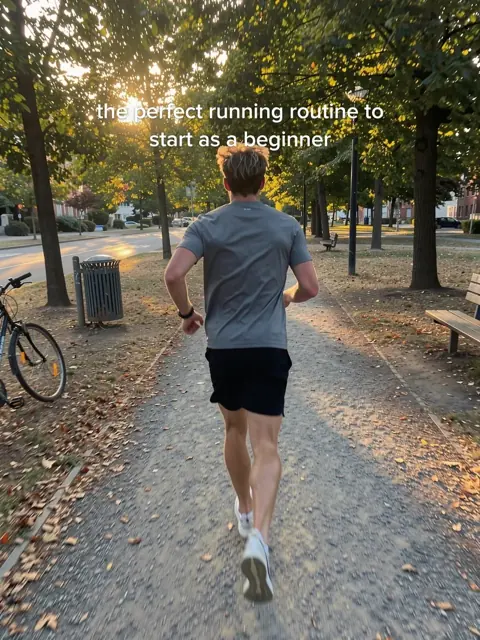 Cover: a man running on a park path, the perfect running routine for beginners