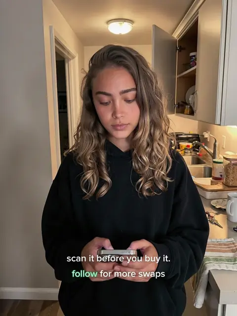 Slide 6: she reads her phone in the kitchen, scan it before you buy it